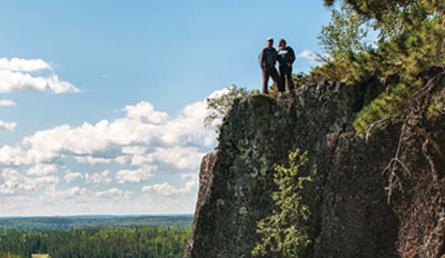 Couple standing on a cliff